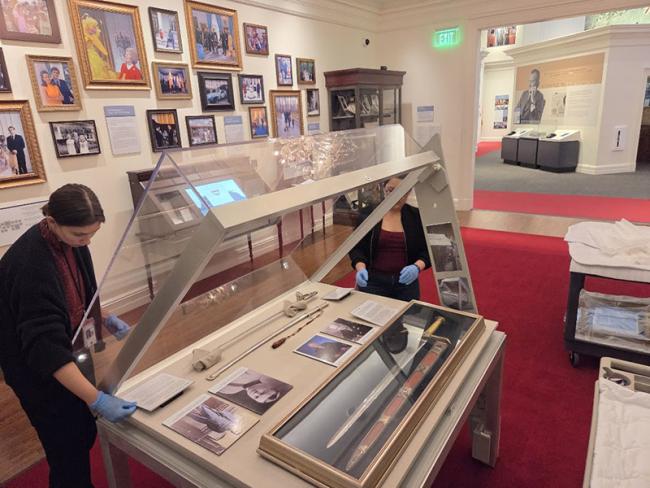 Installation of swords owned by President Dwight D. Eisenhower in museum case